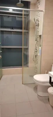 a bathroom with a shower and a toilet at The Robertson by Kuala Lumpur in Kuala Lumpur