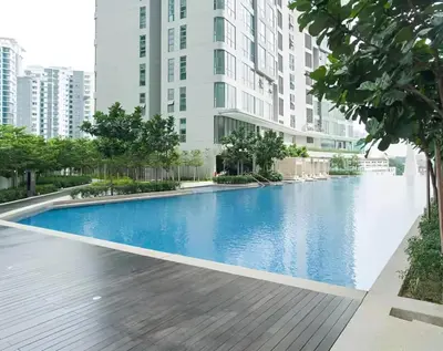 a swimming pool in the middle of a building with tall buildings at The Robertson by Kuala Lumpur in Kuala Lumpur