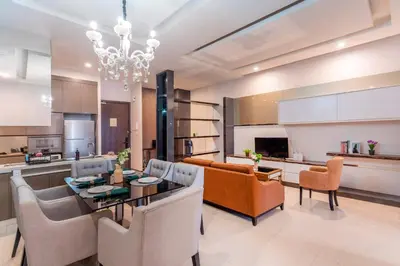 a kitchen and living room with a table and chairs at Dorsett Bukit Bintang 5min to Pavilion KL in Kuala Lumpur
