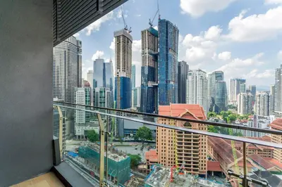a view of a city skyline from a balcony at Dorsett Bukit Bintang 5min to Pavilion KL in Kuala Lumpur