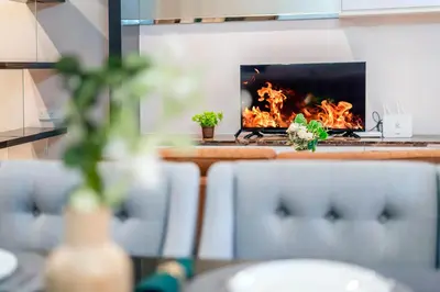 a fireplace in a kitchen with flames in it at Dorsett Bukit Bintang 5min to Pavilion KL in Kuala Lumpur