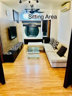 a living room with a couch and a tv at Parkview 2bedroom apartment klcc in Kuala Lumpur