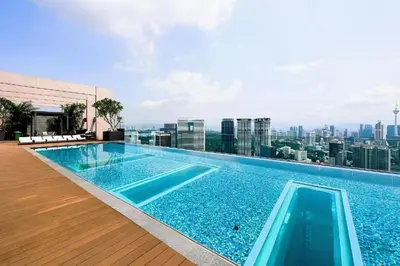 a swimming pool on the roof of a building at Cozy Studio I Riveria City I 1km to KL Sentral in Kuala Lumpur