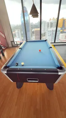 a pool table sitting on top of a wooden floor at Majestic Alaman Suites KLCC in Kuala Lumpur