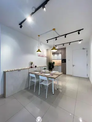 a kitchen and dining room with a table and chairs at Relax and Enjoy ! in Kuala Lumpur