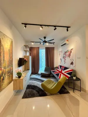 a living room with a ceiling fan and a yellow chair at Relax and Enjoy ! in Kuala Lumpur