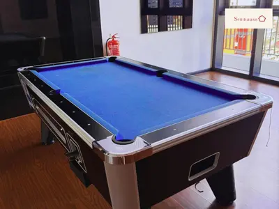 a pool table in a room with at KLCC View & Netflix & Walk to LRT & Sunway Putra in Kuala Lumpur