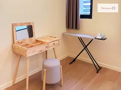 a dressing table and a desk with a mirror and a stool at KLCC View & Netflix & Walk to LRT & Sunway Putra in Kuala Lumpur