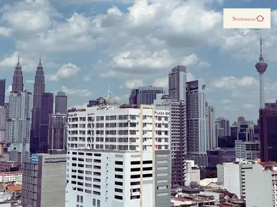 a view of a large city with tall buildings at KLCC View & Netflix & Walk to LRT & Sunway Putra in Kuala Lumpur