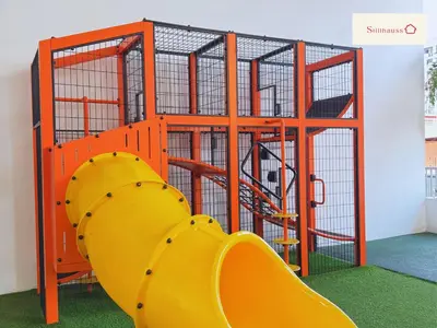 a playground with a yellow slide in a room at KLCC View & Netflix & Walk to LRT & Sunway Putra in Kuala Lumpur