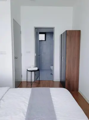 a bedroom with a bed and a bathroom with a shower at M VERTICA Isyak Homestay in Kuala Lumpur