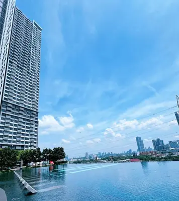a view of a river in a city with buildings at M VERTICA Isyak Homestay in Kuala Lumpur