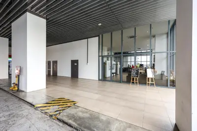an empty lobby of a building with glass windows at Heaven Suites KL in Kuala Lumpur