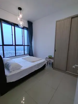 a bedroom with a bed and a large window at Service Apartment Sunway Velocity in Kuala Lumpur