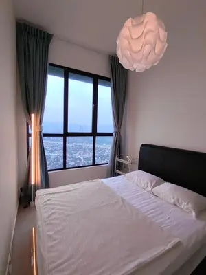 a bedroom with a white bed and a large window at Service Apartment Sunway Velocity in Kuala Lumpur