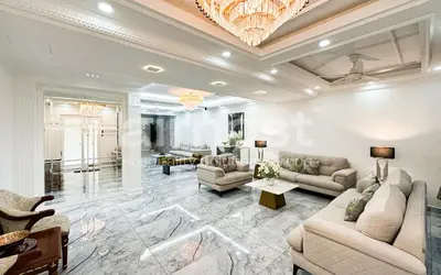 a large living room with couches and a chandelier at Family House at Setiawangsa by Airhost in Kuala Lumpur