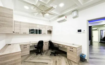 a room with a desk with two chairs and a ceiling at Family House at Setiawangsa by Airhost in Kuala Lumpur