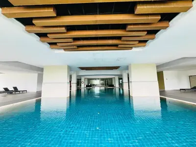 a swimming pool with a chandelier in a building at 231TR Service Suites by DeUrban in Kuala Lumpur