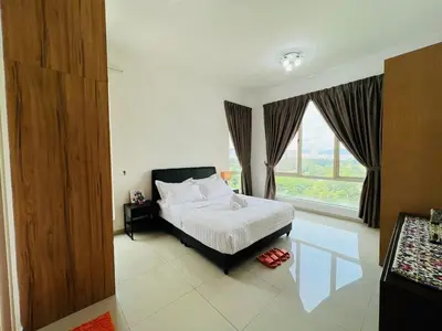a bedroom with a bed and a large window at 231TR Service Suites by DeUrban in Kuala Lumpur
