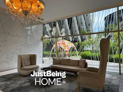 a living room with a couch and chairs and a chandelier at Just Being Home 4pax 1BR 1BA 1Queen 1Sofa in Kuala Lumpur