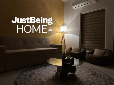 a living room with a couch and a table at Just Being Home 4pax 1BR 1BA 1Queen 1Sofa in Kuala Lumpur
