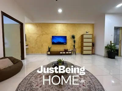 a living room with a couch and a tv on a wall at Just Being Home 4pax 1BR 1BA 1Queen 1Sofa in Kuala Lumpur