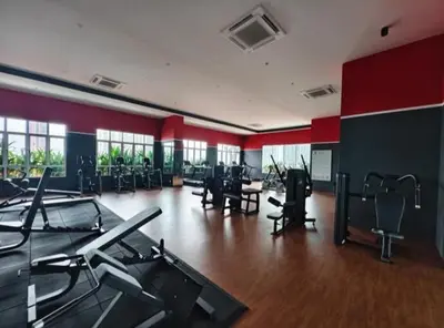 a gym with desks and chairs in a large room at Setapak KL Apt 2 Room Mus'lim in Kuala Lumpur