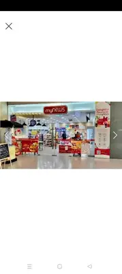 a store with a sign that reads supermarket at Summer Suites By SmartWill in Gua Sai