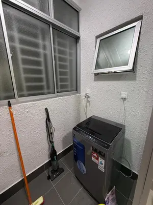 a room with a window and a computer on the floor at Razak City Kuala Lumpur A2-30 in Kuala Lumpur