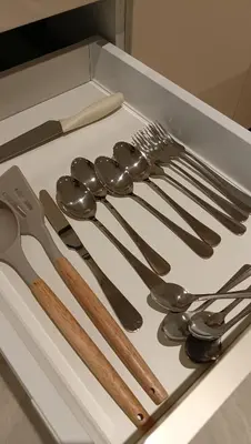 a group of utensils sitting on top of a box at Quill Residence- Minimalist Urban Condo by Azmila in Kuala Lumpur