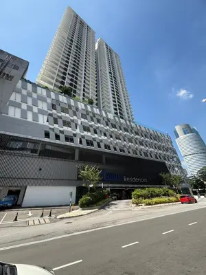 a building with two tall skyscrapers in a city at Quill Residence- Minimalist Urban Condo by Azmila in Kuala Lumpur