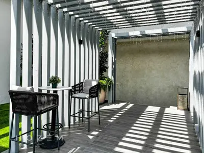 a patio with two chairs and a table on a building at SBR1B Hozem KL2601 Apartment Bukit Bintang in Kuala Lumpur