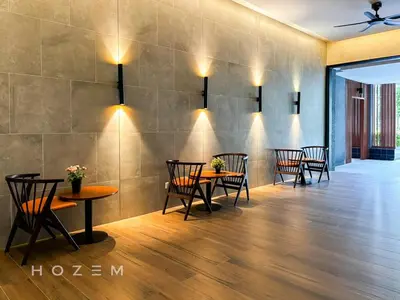 a group of tables and chairs in a room at 2BR1B Hozem KL4409 Apartment Bukit Bintang in Kuala Lumpur