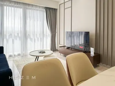 a living room with a tv and a table and chairs at 2BR2B Hozem KL2708 Apartment Bukit Bintang in Kuala Lumpur