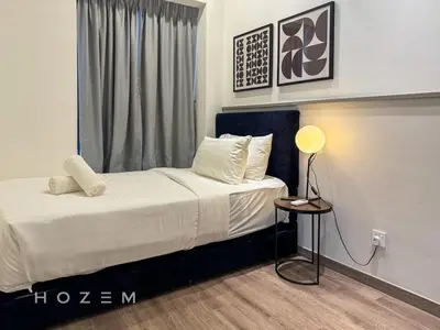 a bedroom with a bed with a lamp and a window at 2BR2B Hozem KL2708 Apartment Bukit Bintang in Kuala Lumpur