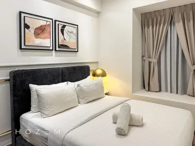 a bedroom with a white bed with a window at 2BR2B Hozem KL1812 Apartment Bukit Bintang in Kuala Lumpur