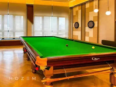 a pool table in a room with afits at 2BR2B Hozem KL1713 Apartment Bukit Bintang in Kuala Lumpur