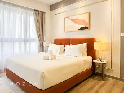 a bedroom with a bed with a teddy bear on it at 2BR2B Hozem KL3214 Apartment Bukit Bintang in Kuala Lumpur