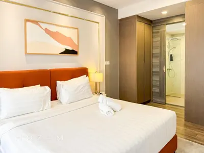 a bedroom with a large bed with white sheets at 2BR2B Hozem KL3214 Apartment Bukit Bintang in Kuala Lumpur