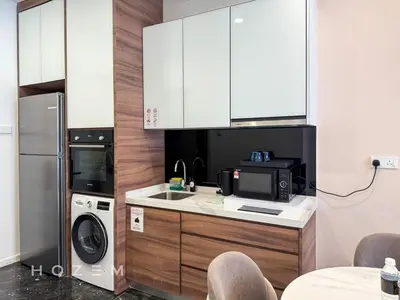 a kitchen with a microwave and a washer and dryer at 2BR2B Hozem KL2903 Apartment KLCC in Kuala Lumpur