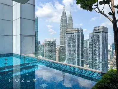 a swimming pool on the roof of a building with a city at 2BR2B Hozem KL3802 Apartment KLCC in Kuala Lumpur