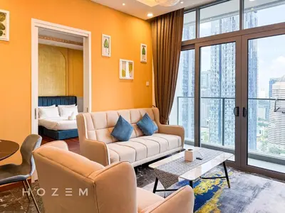 a living room with a couch and a large window at 2BR2B Hozem KL3709 Apartment KLCC in Kuala Lumpur