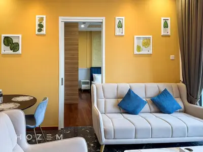 a living room with a white couch and a table at 2BR2B Hozem KL3709 Apartment KLCC in Kuala Lumpur