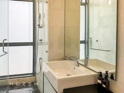 a bathroom with a sink and a shower and a mirror at 2BR2B Hozem KL4910 Apartment KLCC in Kuala Lumpur