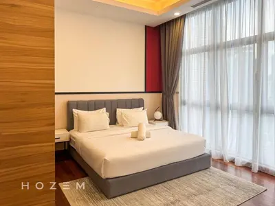 a bedroom with a bed with a teddy bear on it at 2BR2B Hozem KL5009 Apartment KLCC in Kuala Lumpur