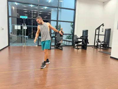 a man is exercising in a gymnasium at Chambers Residence by Golden Homestay in Kuala Lumpur