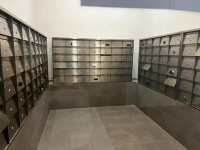 a locker room with lockers and a wall of shoes at Chambers Residence by Fancy House in Kuala Lumpur