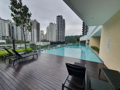 a large swimming pool on a balcony of a building at Inspirasi Mont Kiara Cozy Homestay with Pool View Kuala Lumpur in Kuala Lumpur
