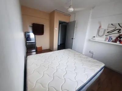 a bedroom with a white bed in a room at Homestay Lala in Kuala Lumpur