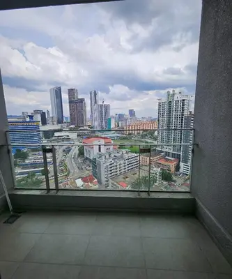 a large window with a view of a city at The Signature Suites at Robertson Bukit Bintang in Kuala Lumpur